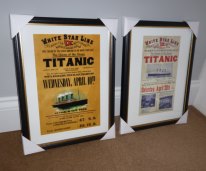 A pair of framed Titanic advertising posters